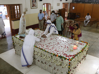Nuns from the Catholic Order of the Missionaries of Charity attend a special prayer to mark the 111th birth anniversary of Mother Teresa at...