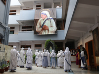Nuns from Missionaries of Charity attend a special prayer to mark the 111th birth anniversary of Mother Teresa, near her tomb at the Mother...