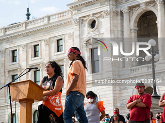 Taysha Martineau of Fond du Lac tribe and founder of Camp Migizi Jim Northrup speak during a rally at Saint Paul, the Minnesota State Capito...