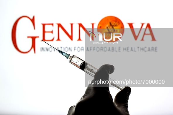 In this photo illustration, a close up of a hand holding a medical syringe in front of the Gennova Biopharmaceuticals Ltd logo 