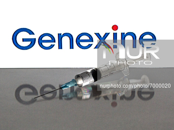 In this photo illustration, a close up of a medical syringe in front of the Genexine, Inc. logo (