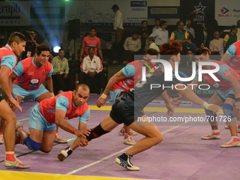 Players in action during the Pro Kabaddi league match between Jaipur Pink Panthers  and Bengal Warriors in Kolkata, India on Wednesday , Jul...