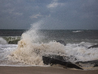 Waves crash on shore as remnants of Hurrican Ida hit Cape May Point, New Jersey, the southern-most tip of the state on September 1, 2021 (