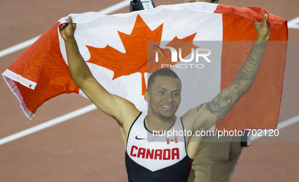 (150723) -- TORONTO, July 23, 2015()-- Andre De Grasse of Canada celebrates after winning the men's 100m final race of the athletics event a...