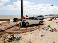 Cars damaged by floods on street filled with mud and derbis the day after flash floods on September 2, 2021 in Les Cases dAlcanar, Spain.
To...