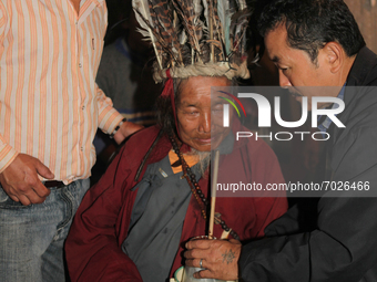 A 90 year-old Lepcha Bomthing (Lepcha priest) drinks che (a traditional millet beer) as he offers prayers during an animal sacrifice ceremon...