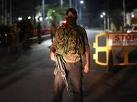 Indian forces stand alert during night curfew after Senior Pro-Freedom leader Syed Ali Shah Geelani, 92, passed away at his residence in Sri...