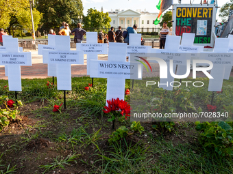 Crosses stand across the street from the White House in memory of the 13 Americans service members killed while evacuating Americans and Afg...