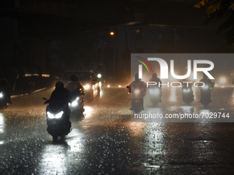 Motorcyclists ride their bikes in heavy rain in Bangkok, Thailand, 04 September 2021. (
