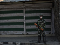 An Indian paramilitary trooper stands alert during restrictions in old city Srinagar, Indian Administered Kashmir on 03 September 2021. Curf...