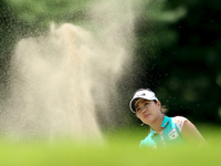 Meena Lee of South Korea hits the ball from the sand trap on the 8th green during the first round of the Meijer LPGA Classic golf tournament...