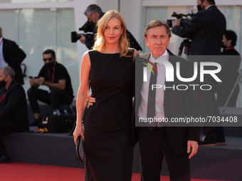 Nikki Butler and Tim Roth arrive on the red carpet ahead of the ''Sundown'' screening during the 78th Venice Film Festival on September 05,...