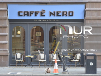 Road furniture standing outside a Cafe Nero coffee shop on Saturday 16th May 2015 in Manchester. (