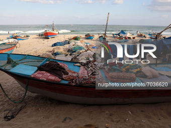 Palestinian fishermen work along a beach in Khan Yunis, southern Gaza Strip, on September 6, 2021.
 (