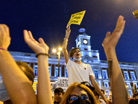 Hundreds of protesters in the streets of Madrid on Wednesday evening, chanting, holding placards reading `justicia´ with some wrapped in rai...