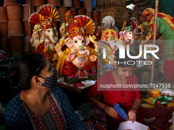 Artisans prepare idols of the elephant-headed Hindu god Ganesha ahead of the Ganesh Chaturthi festival, at a workshop in New Delhi, India on...