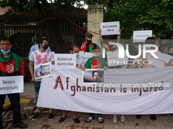 Afghan nationals residing in India hold placards as they protest against Pakistan's alleged support to the Taliban, during a demonstration i...