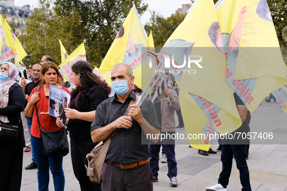 This Kurdish protester holds flags bearing the effigy of Abdullah Öcalan. In Paris, France, on September 11, 2021 as in many cities in Europ...