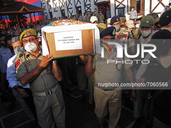 SRINAGAR, KASHMIR, INDIA-SEPTEMBER 12: Director General of Police Jammu and Kashmir (R) shoulder the coffin containing the dead body of a po...