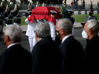 Portuguese military personnel carries the flag-drapped coffin of the late former Portuguese President Jorge Sampaio into Jeronimos Monastery...
