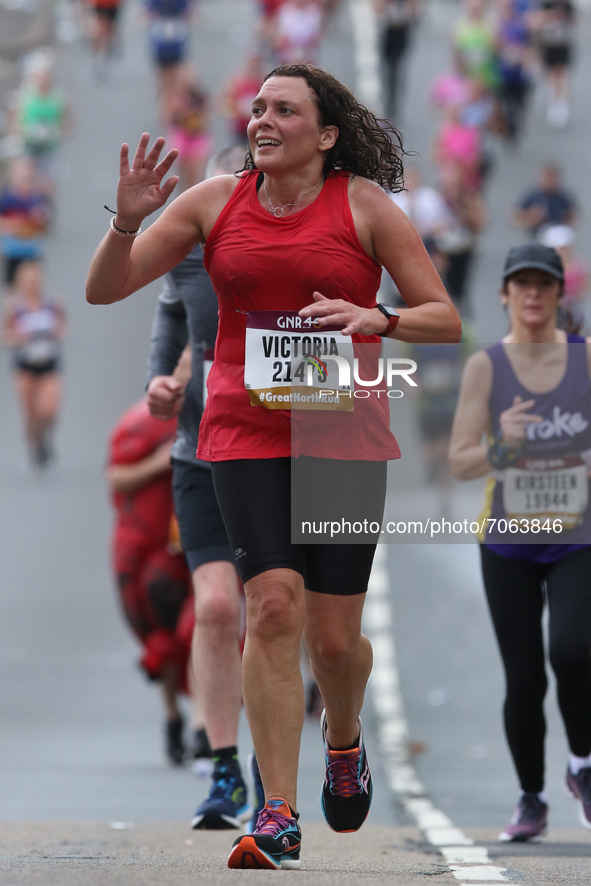 A runner waves during the BUPA Great North Run in Newcastle upon Tyne, England on Sunday 12th September 2021.  