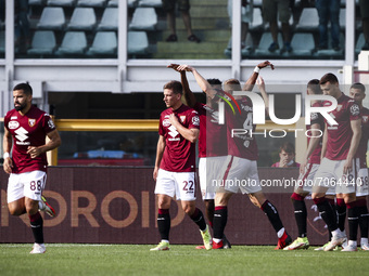 Torino midfielder Tommaso Pobega (4) celebrates with his teammates after scoring his goal to make it 3-0 during the Serie A football match n...