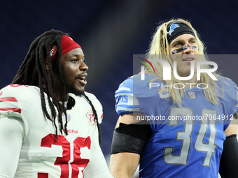 San Francisco 49ers defensive back Marcell Harris (36) and Detroit Lions middle linebacker Alex Anzalone (34) walk off the field at the conc...