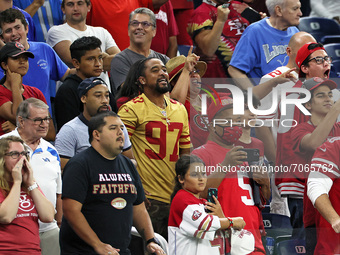 49ers fans watch the final quarter of  an NFL football game between the Detroit Lions and the San Francisco 49ers in Detroit, Michigan USA,...