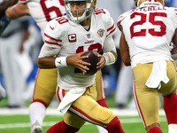 San Francisco 49ers quarterback Jimmy Garoppolo (10) drops back to pass during the second half of an NFL football game against the Detroit L...