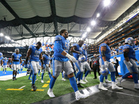 Detroit Lions players return to the locker room after warmups during an NFL football game against the San Francisco 49ers in Detroit, Michig...