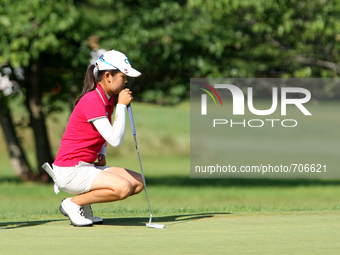 Wei-Ling Hsu of Chinese Taipei lines up her putt on the first green during the final round of the Marathon LPGA Classic golf tournament at B...