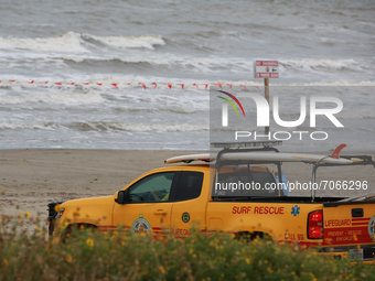 Rescue officials watch over the beach in Galveston, Texas on September 12th, 2021, as Tropical Storm Nicholas approaches.  (