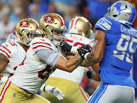 San Francisco 49ers tight end George Kittle (85) faces Detroit Lions defensive end Romeo Okwara (95) during an NFL football game between the...
