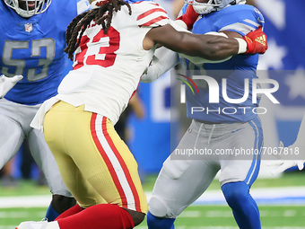 San Francisco 49ers running back JaMycal Hasty (23) faces off with Detroit Lions defensive back C.J. Moore (38) during an NFL football game...