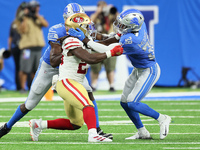 San Francisco 49ers running back JaMycal Hasty (23) faces off with Detroit Lions defensive back C.J. Moore (38) during an NFL football game...
