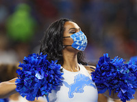 A Detroit Lions cheerleader performs after the end of the first quarter during an NFL football game between the Detroit Lions and the San Fr...