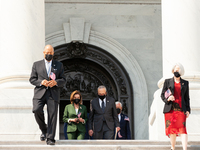 House Speaker Nancy Pelosi (D-CA) and Senate Majority Leader Chuck Schumer (D-NY) lead members of Congress down the center steps for a cerem...