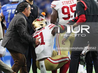 San Francisco 49ers linebacker Azeez Al-Shaair (51) is assisted to his feet after an injury during an NFL football game between the Detroit...