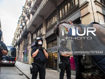 Protester with a Guy Fawkes mask is seen in front of the police.
The political party The Popular Unity Candidacy (CUP) and the Committees fo...