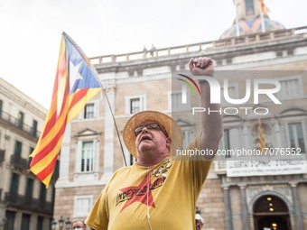 Protester in front of the Generality of Catalonia is seen with a shirt that says, Independence.
The political party The Popular Unity Candid...