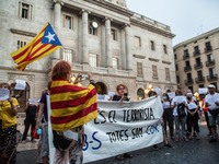 Protesters are seen with a banner and Catalan pro-independence flags.
The political party The Popular Unity Candidacy (CUP) and the Committe...