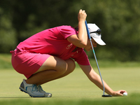 Caroline Masson of Germany places her ball to putt on the 8th green during the final round of the Marathon LPGA Classic golf tournament at B...
