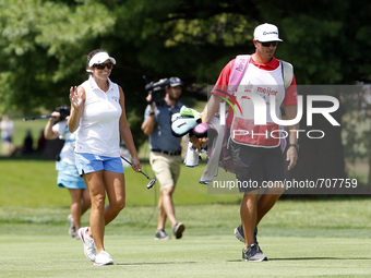 Gerina Piller of Roswell, New Mexico greets the crowd as she approaches the 18th green during the final round of the Marathon LPGA Classic g...