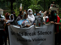 Afghan women hold placards during a demonstration against Pakistan's alleged support to the Taliban, in New Delhi, India on September 16, 20...