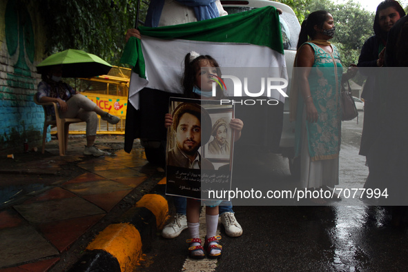 A young Afghan girl holds a placard during a protest against Pakistan's alleged support to the Taliban, in New Delhi, India on September 16,...