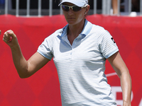 Brittany Lang of Mckinney, Texas reacts after making her putt on the 18th green during the final round of the Marathon LPGA Classic golf tou...