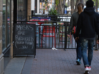 SIgn 'Masks Are Requested' seen outside a restaurant on Whyte Avenue in Edmonton.
Alberta has declared a state of public health emergency an...