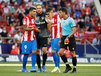 Referee shows red card to Joao Felix of Atletico de Madrid during the La Liga match between Atletico de Madrid and Athletic Club Bilbao at W...