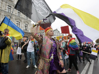 People attend the annual KyivPride gay parade as riot police provide security in Kyiv, Ukraine on 19 September 2021. LGBT  (Lesbian, Gay, Bi...