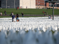 Over 670,000 White flags representing those killed by COVID-19 In America: Remember Memorial cover the National Mall around the Washington M...